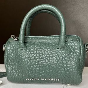 Brandon Blackwood mini duffle - dark green pebble grain leather